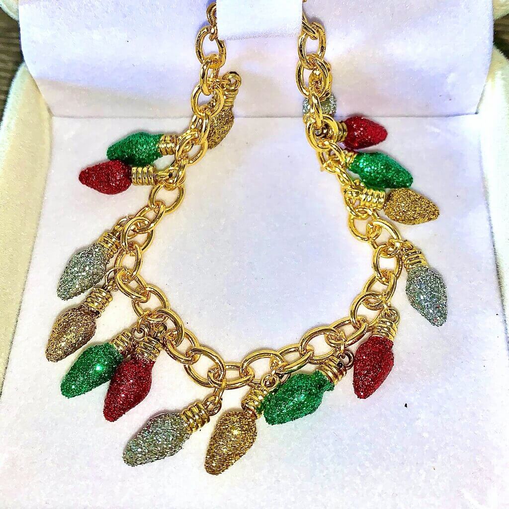 dainty gold bracelet with christmas light bulb charms covered in red, yellow, green & white glitter - Santaland