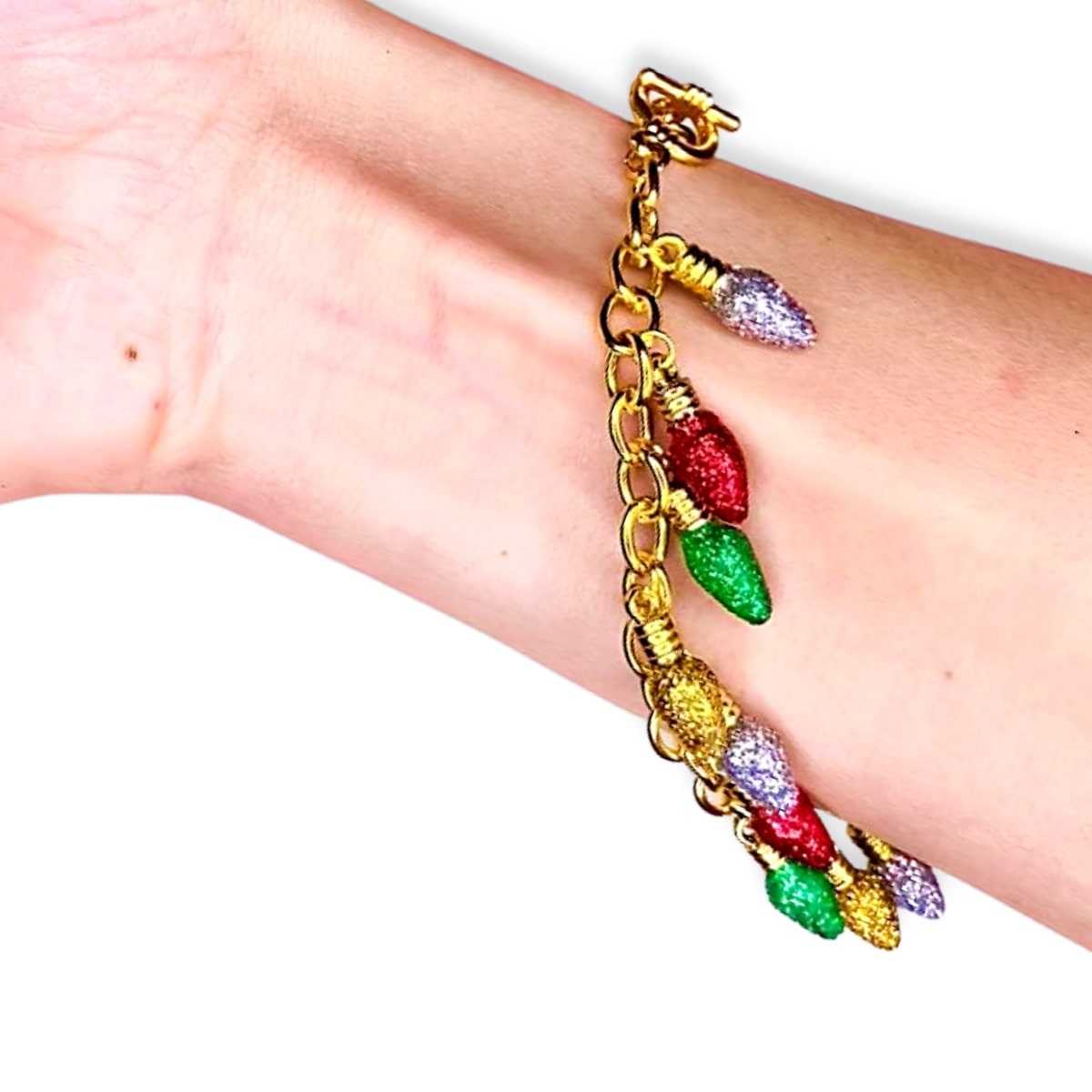 dainty gold bracelet with christmas light bulb charms covered in red, yellow, green & white glitter - Santaland